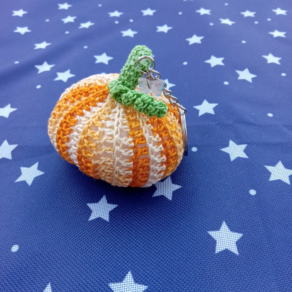 NWT Orange, cream and yellow pumpkin keychain with butterfly charm.